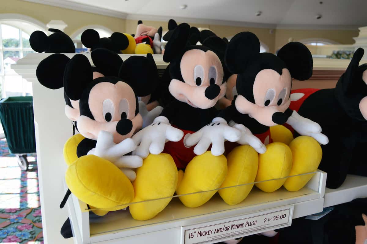A shelf of Mickey Mouse plush