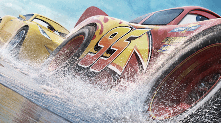 Two animated race cars, one red with the number 95 and one yellow, speed on a wet track, splashing water as they race side by side under a blue sky.