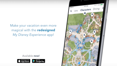 Partial smartphone screen displays a colorful Disney park map. Text reads, "Make your vacation even more magical with the redesigned My Disney Experience app!" App Store and Google Play logos are shown below with "Available now!.