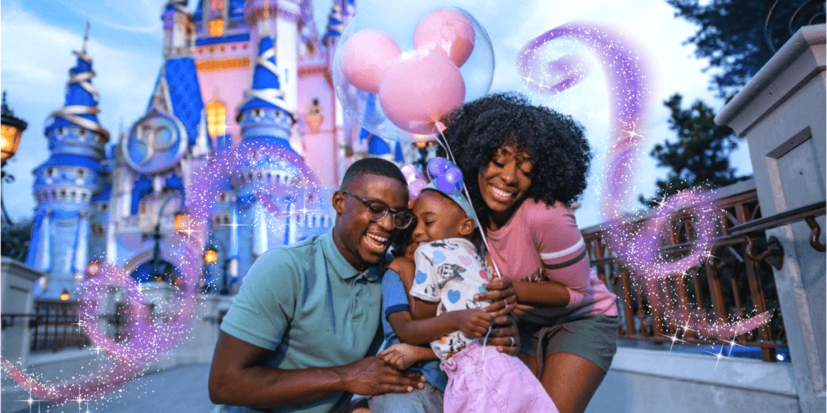 family outside the cinderella castle, magic sparkles