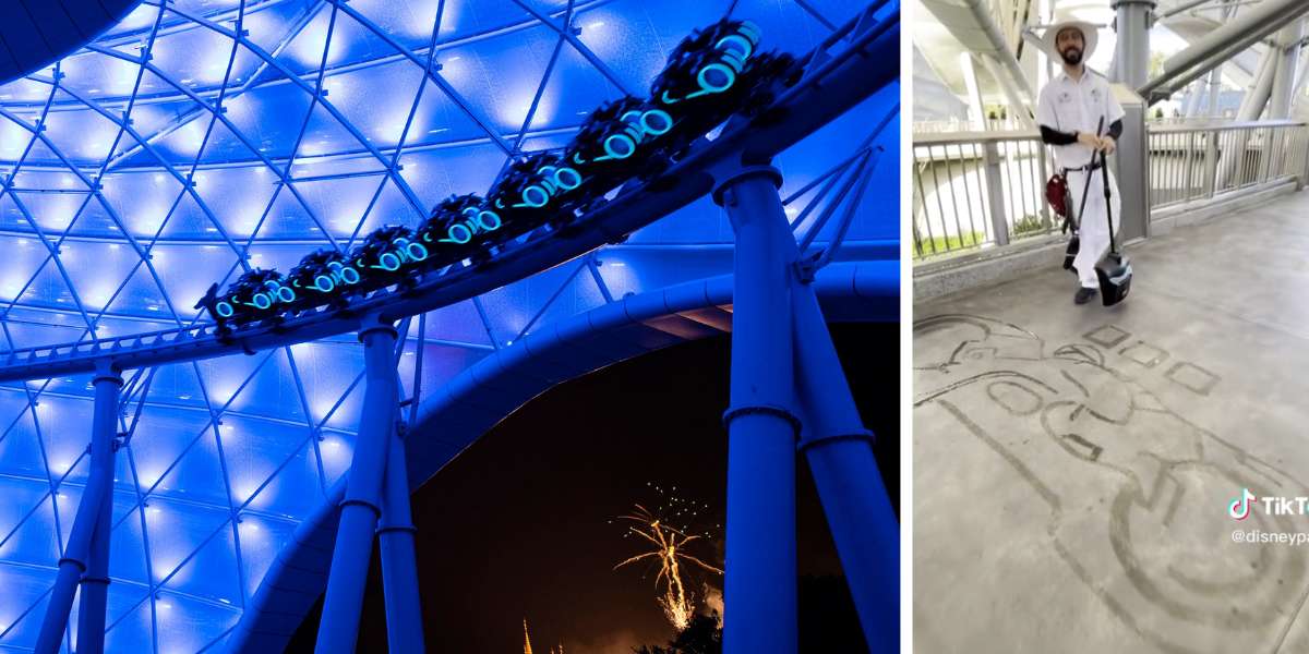 a coaster rides down track in blue beside water art in the shape of a ligtcycle by a bearded cast member man in white