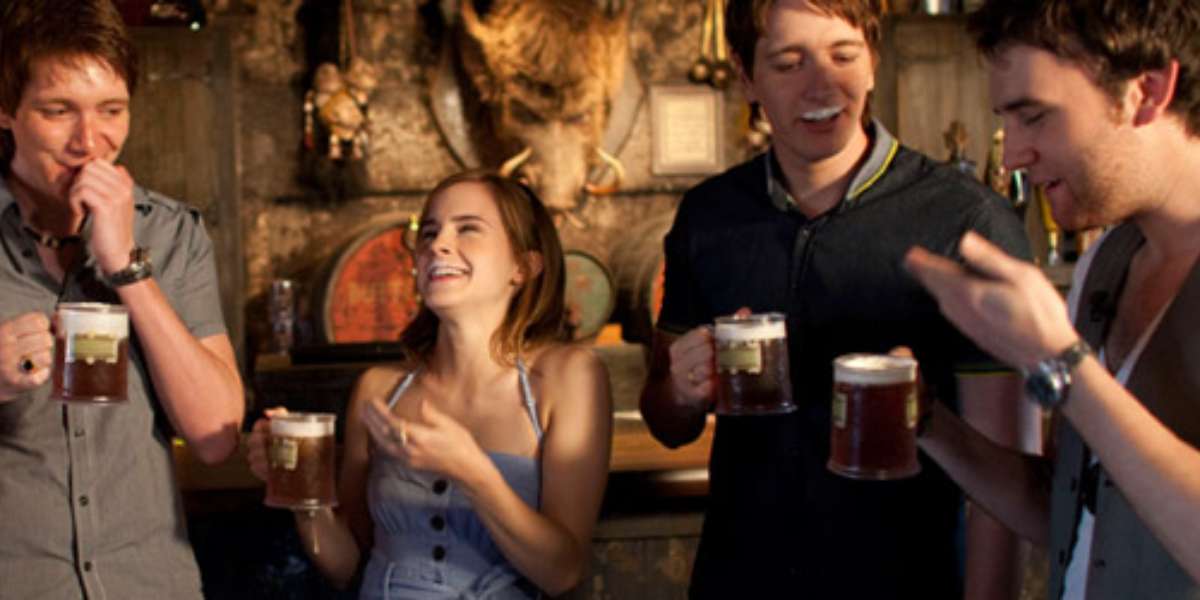 harry potter actors like emma watson laugh at the foam on their lips while drinking butterbeer