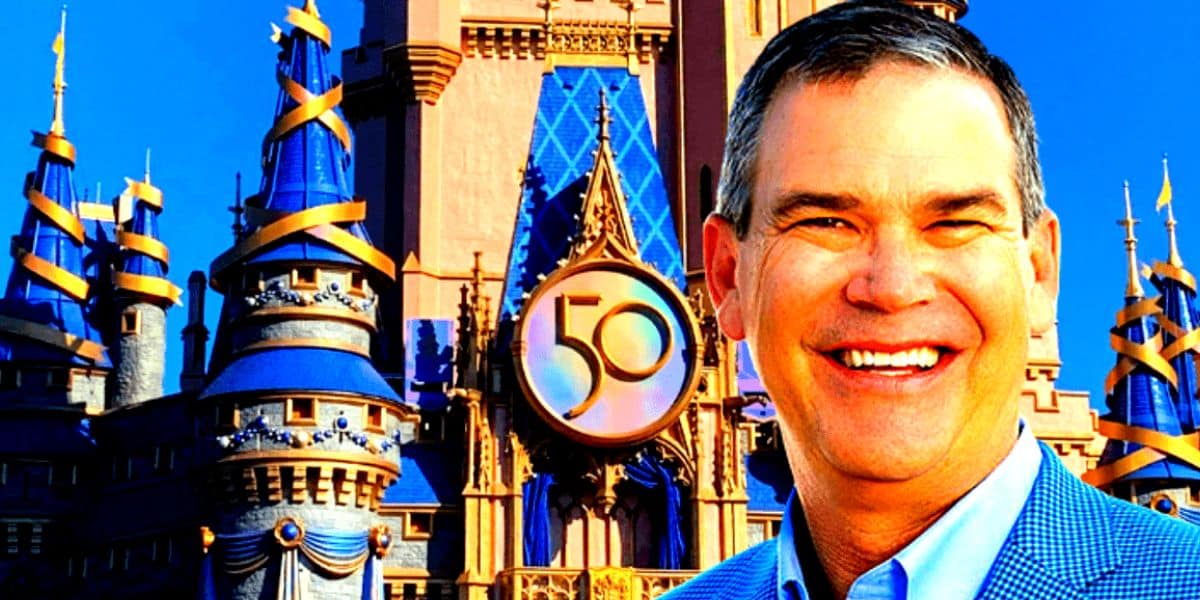 disney world cinderella castle with man's face in front of it