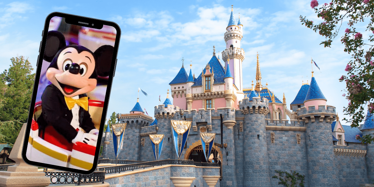 Phone with Mickey on it in front of Disneyland Castle