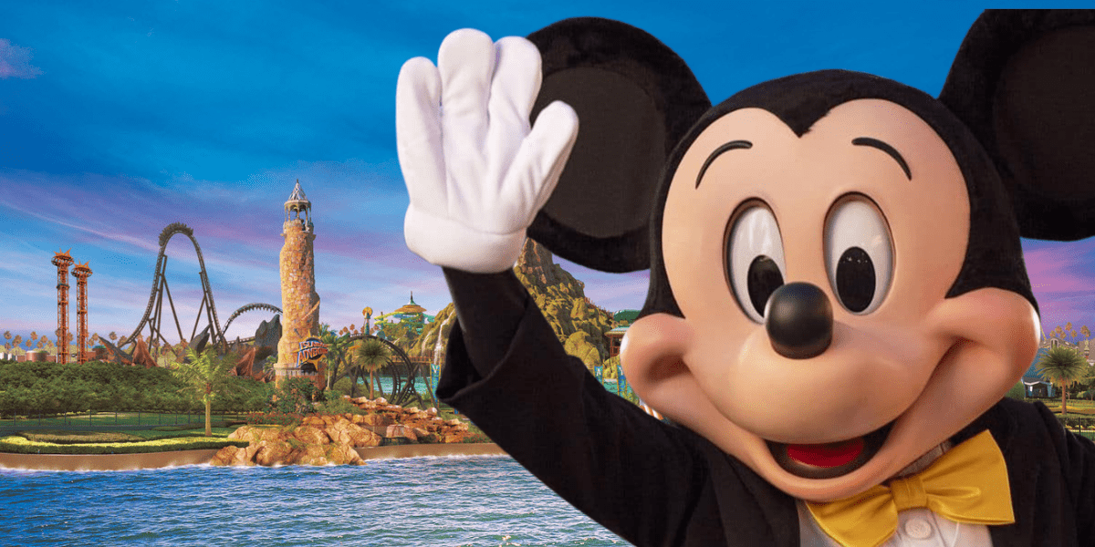 mickey mouse waving, universal orlando resort in the background