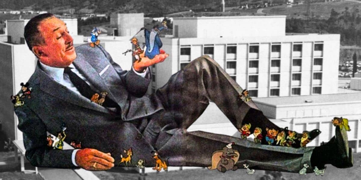 Walt Disney laying down with characters in his hand