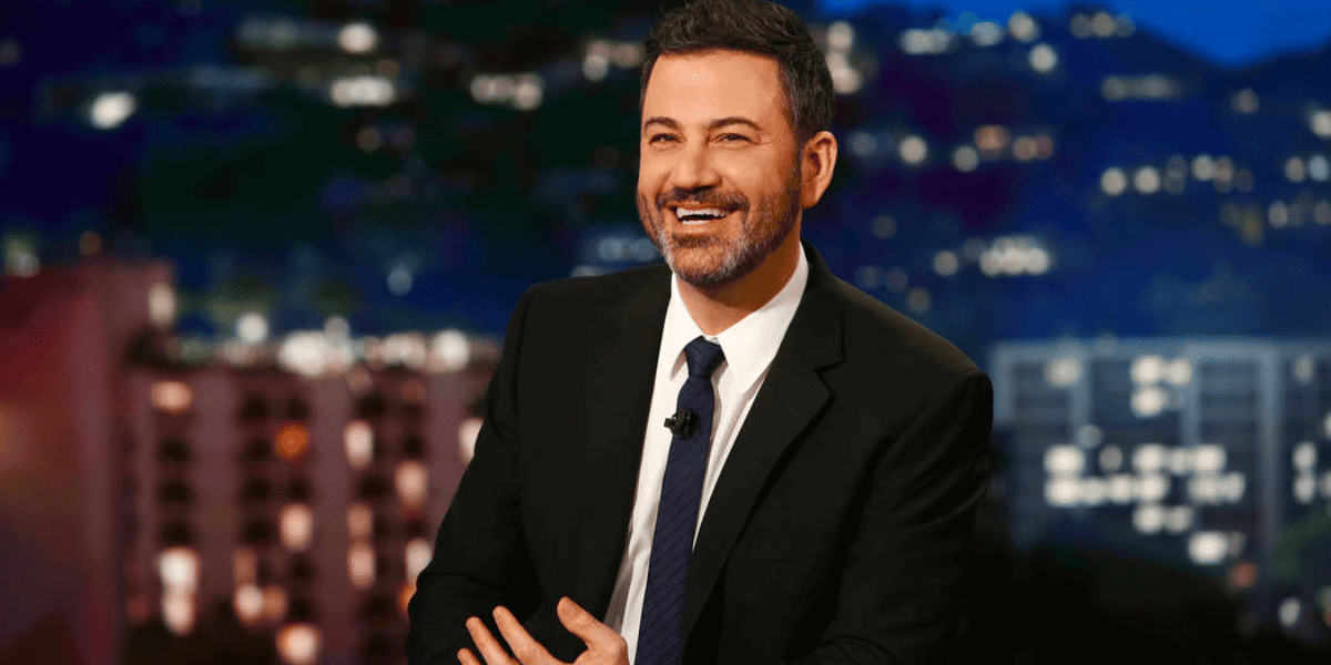 jimmy kimmel at desk black suit and tie