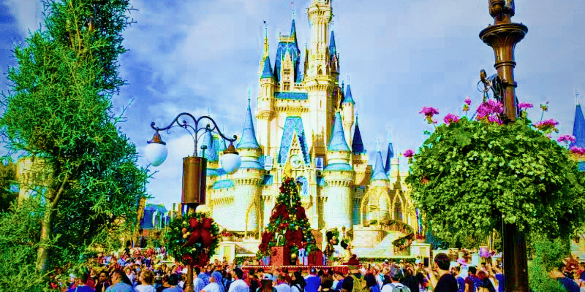 cinderella castle holiday parade christmas tree crowds of people