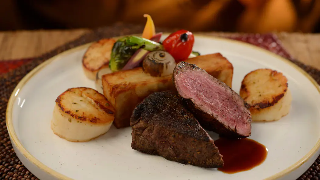 south african braai spiced beef tenderloin, seared scallops, potato pave and vegetables