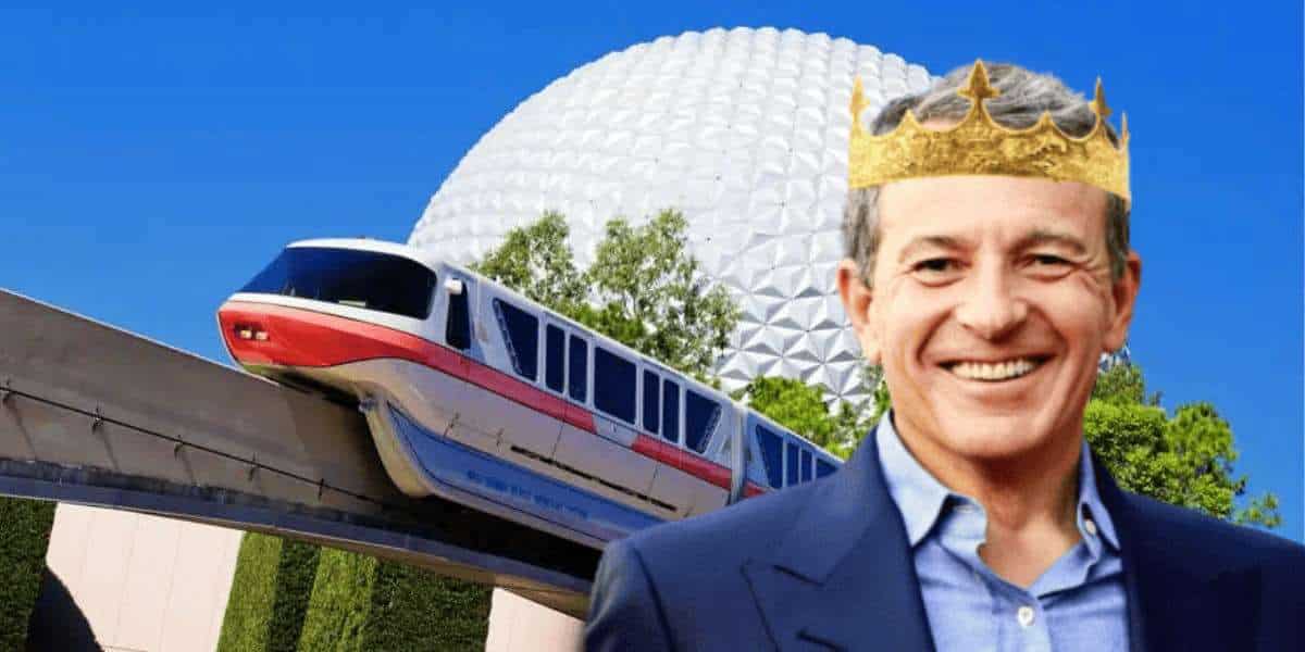Bob Iger wearing crown in front of spaceship earth