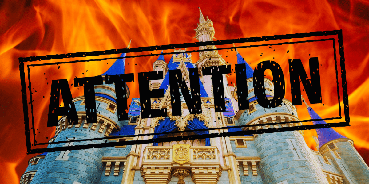 attention sign in front of castle, fire in the background