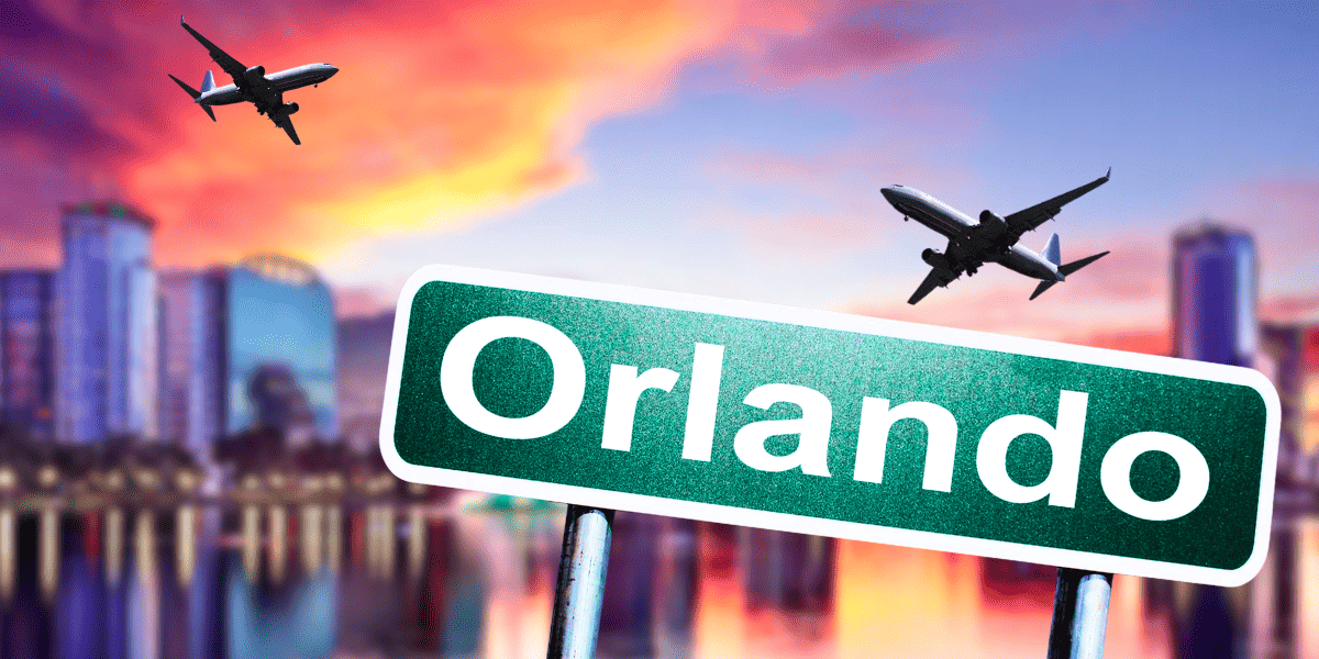 orlando skyline and orlando sign with planes flying overhead
