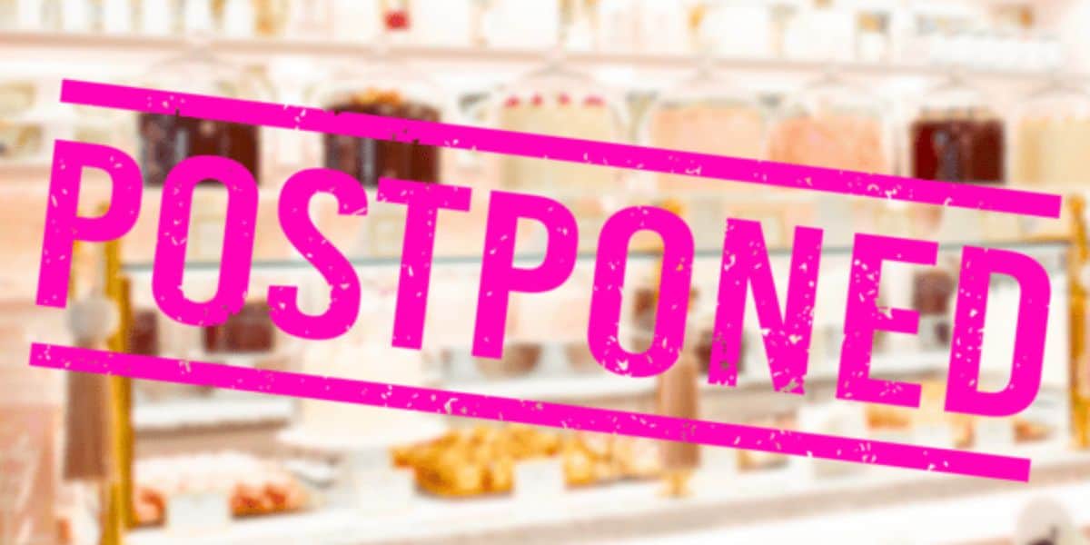 bakery glass case and postponed sign