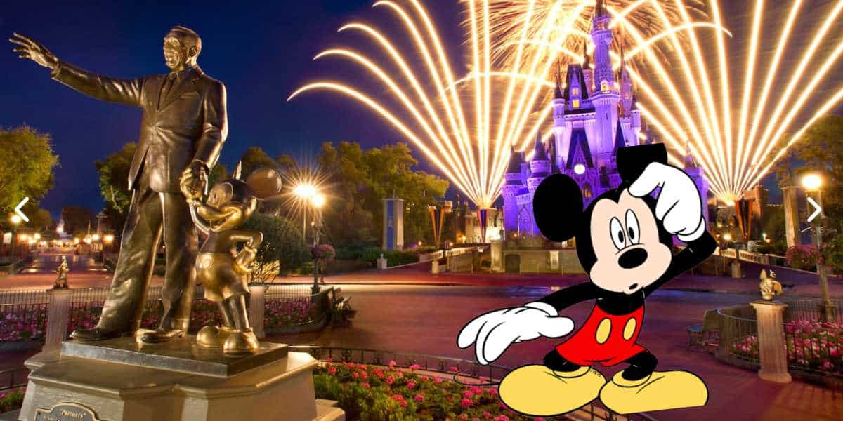 Disney castle with partner statue and cartoon mickey