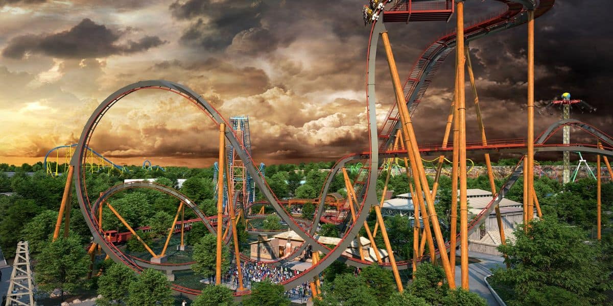 Six Flags Over Georgia during a stormy evening as the sun goes down as shown through an aerial shot of the Six Flags Entertainment theme park.