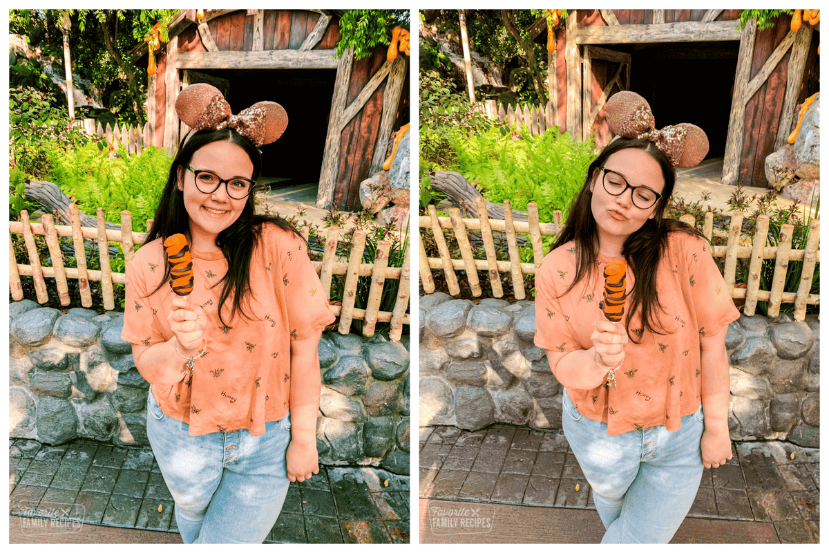 Cute girl wearing Disney ears eating a Tigger tail