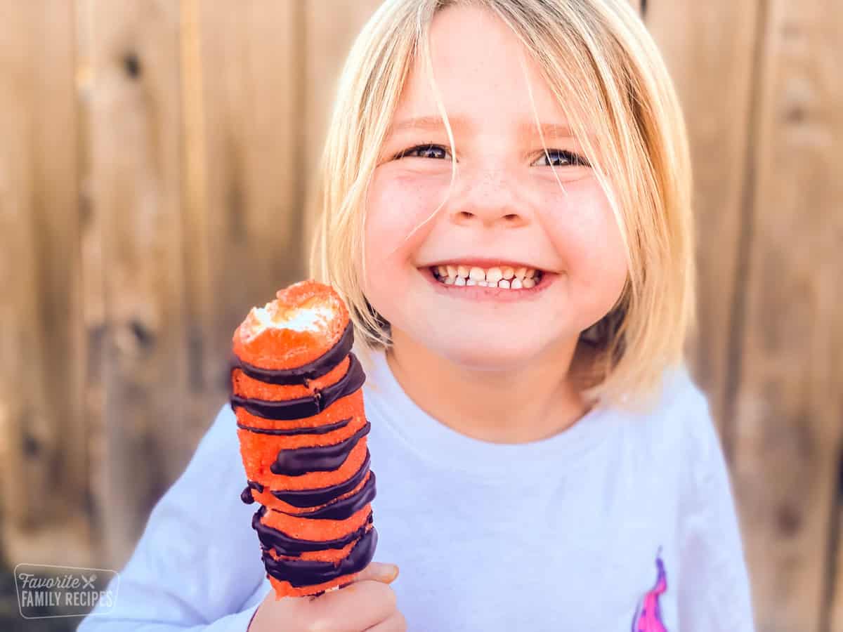 Little girl eating a Tigger Tail