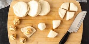 fried biscuit recipe in the work with dough being cut into fours