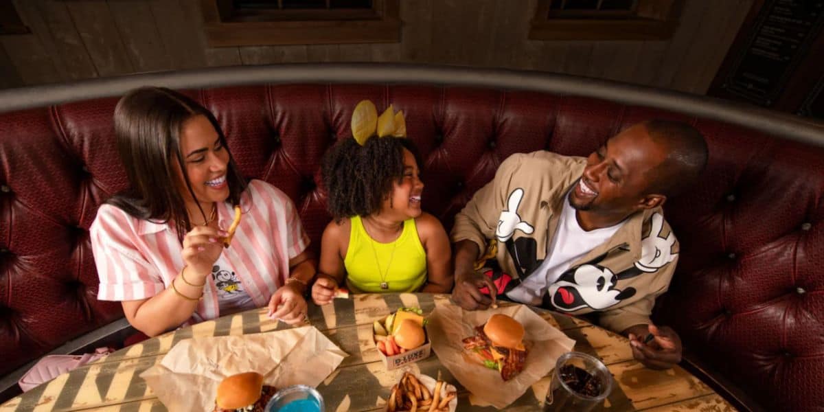 A family of three dining at Walt Disney World Resort