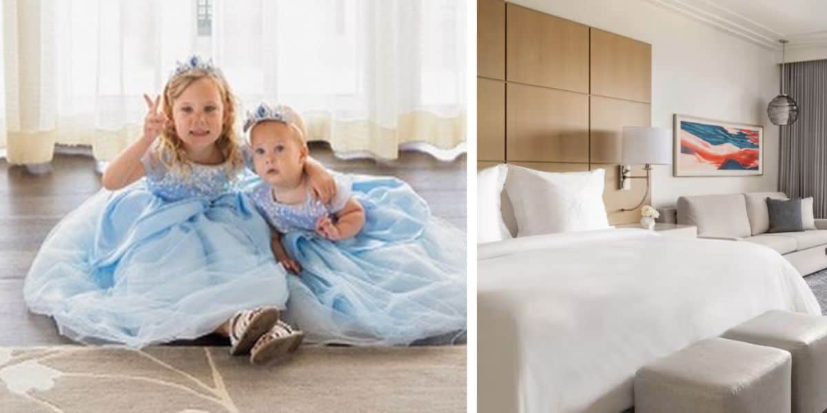 Two young children in blue princess dresses and tiaras are sitting on a carpet, with one child showing a peace sign. The image is split, with the right side showing a modern Four Seasons hotel room featuring a large bed, neutral decor, and an abstract artwork.