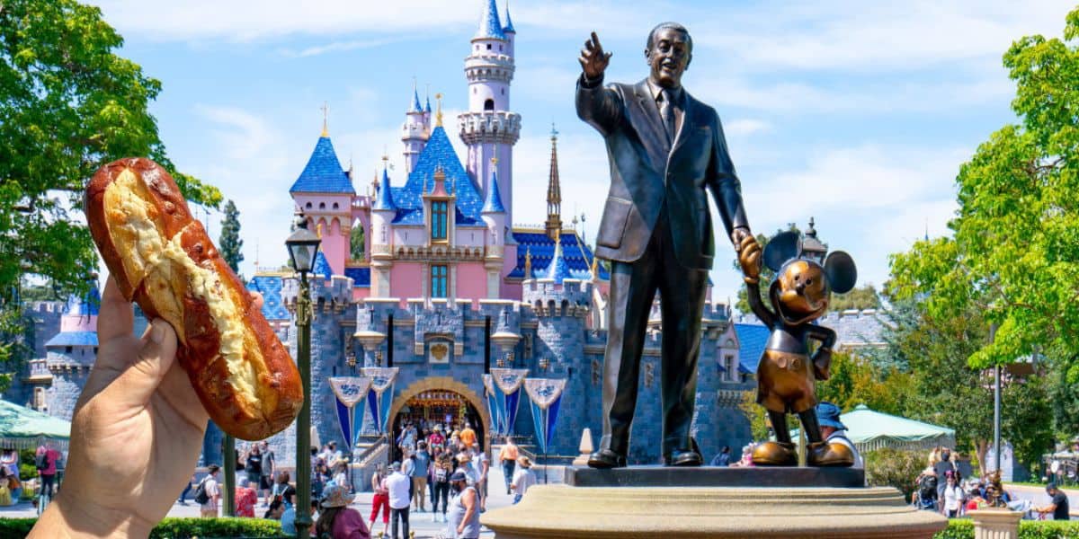 Disneyland Cheesy Garlic Bread in front of Sleeping Beauty Castle and the partners statue at Disneyland