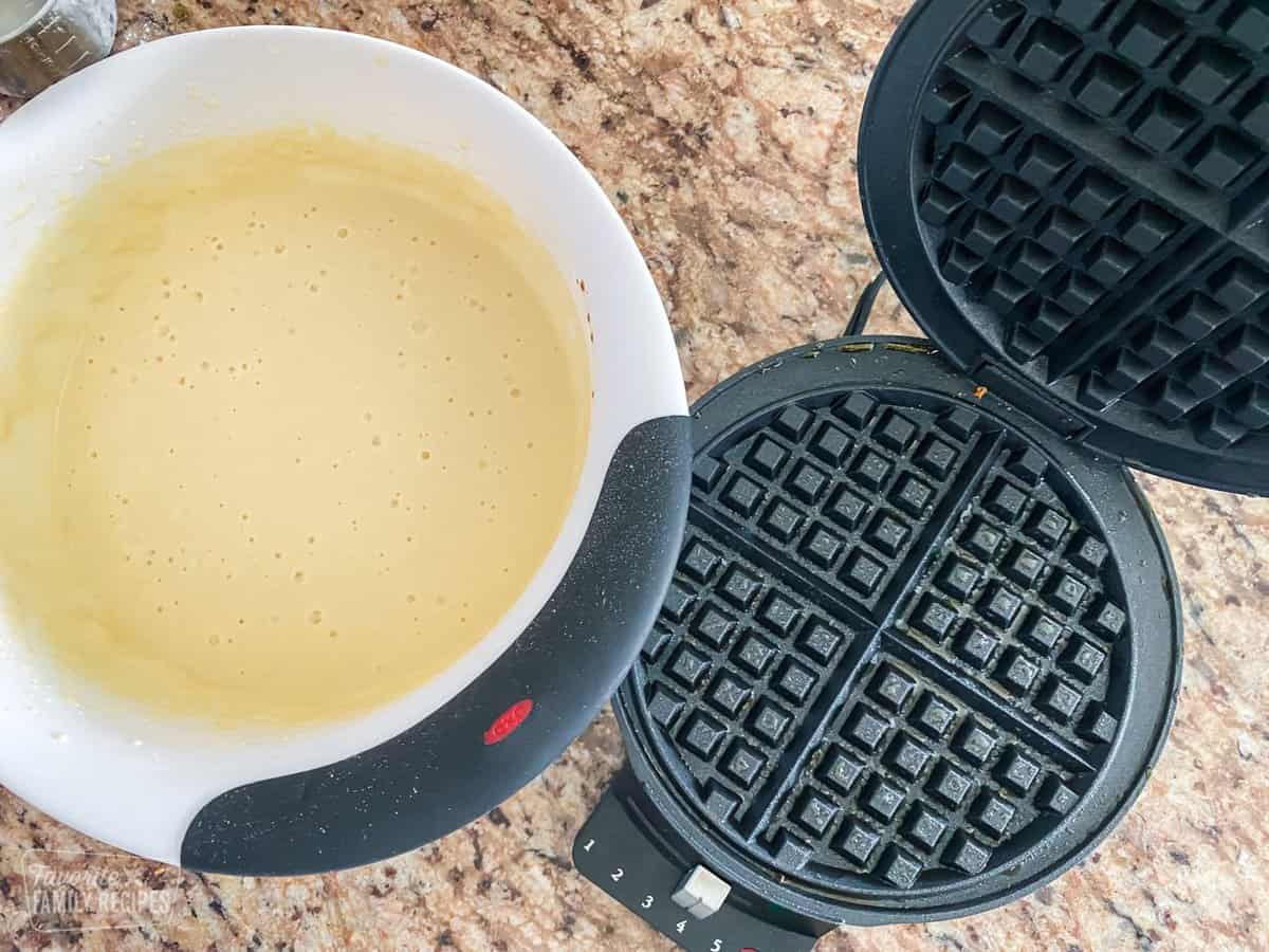 Waffle batter with a waffle maker.