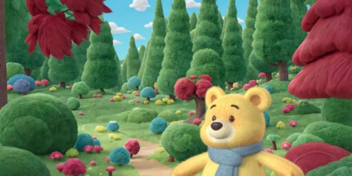 Winnie the Pooh wearing a blue scarf in the Hundred Acre Wood