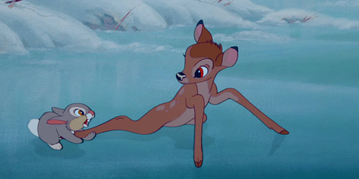An animated scene from "Bambi" featuring a young deer with large eyes and splayed legs trying to stand on ice. A gray rabbit, also with exaggerated eyes, is tugging at the deer's leg, offering assistance. Both characters appear cute and concerned. Snowy background.