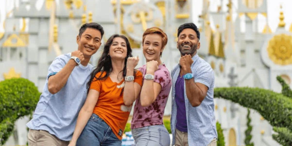Disney World young adult guests wearing and showing off their Magic Bands inside the parks.