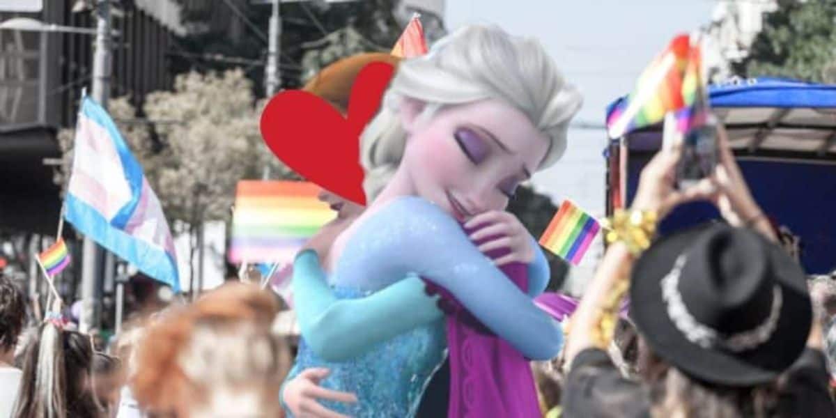 Animated characters, dressed as Elsa and Anna from Disney's Frozen, are hugging in a celebratory embrace. They are surrounded by a vibrant crowd holding rainbow flags, indicating a Pride event. The background is lively with people capturing the moment.