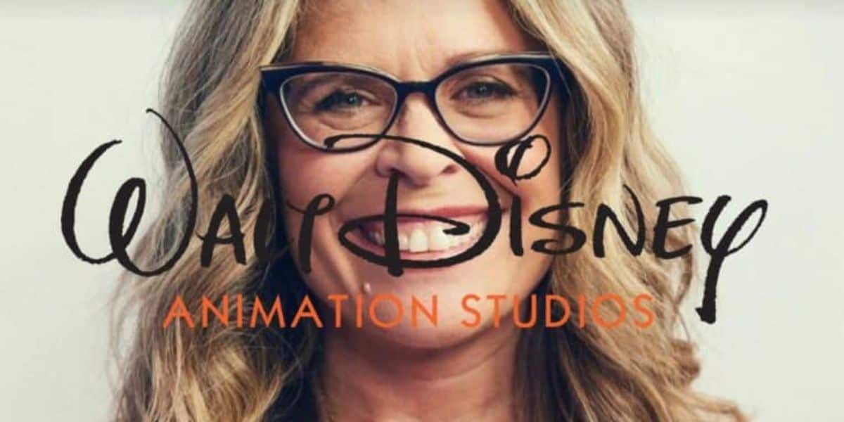 A person with blonde hair and glasses is smiling. The Walt Disney Animation Studios logo is superimposed over the person's face.