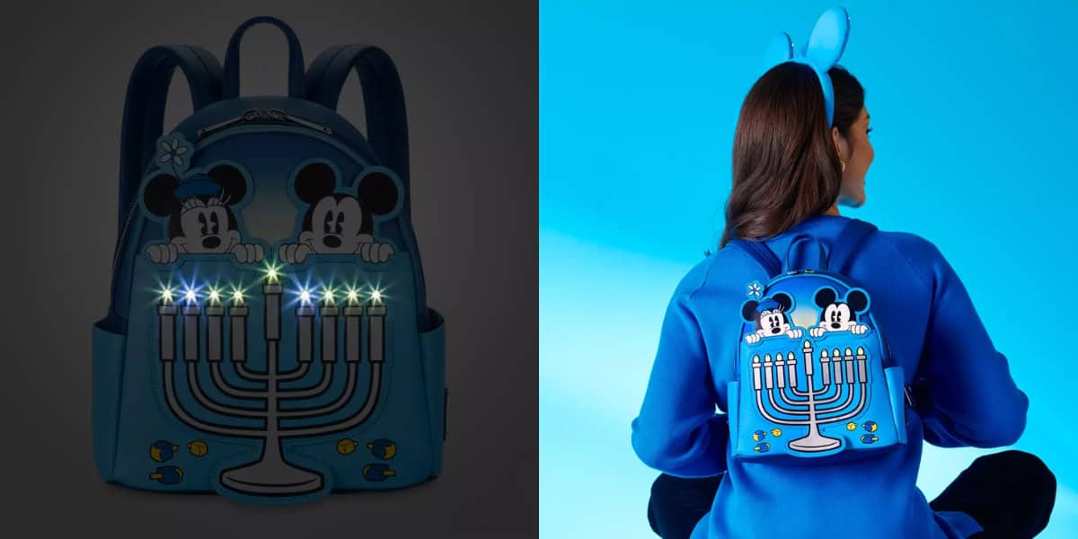 A person wearing a blue outfit and blue mouse ears sits with their back facing the camera, showing a backpack featuring Mickey and Minnie Mouse above a menorah. The backpack has colorful lights on the menorah.