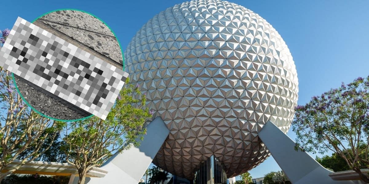Spaceship Earth in the daytime with a blurred photo of concrete in the foreground.