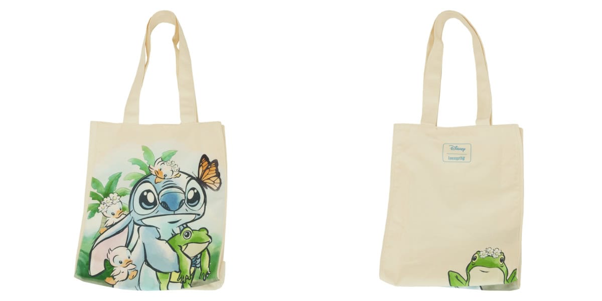 Front and back view of a light-colored tote bag featuring cartoon characters. The front showcases a group of characters, including a blue creature with large eyes, surrounded by smaller animals, and a butterfly. The back has a small logo and a frog at the bottom.