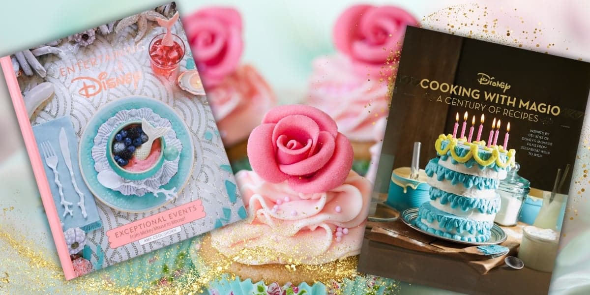 Two cookbooks are displayed among decorative cakes. The first is titled "Entertaining with Disney," featuring a pastel-colored setting. The second is "Cooking with Magic," showing a cake with candles. Pink roses and golden sparkles adorn the scene.