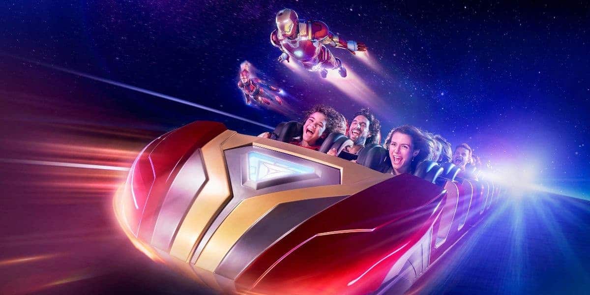 Guests ride Avengers Assemble: Flight Force next to Captain Marvel and Iron Man