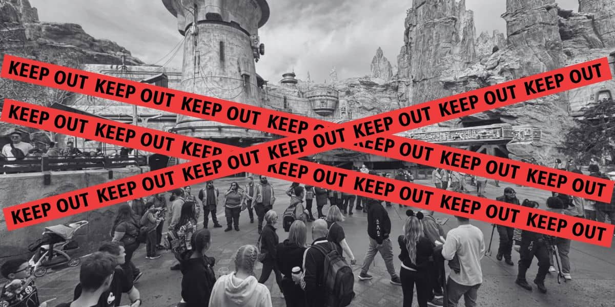 A black and white image of Disney cast members keeping guests away from Millennium Falcon: Smugglers Run with red "KEEP OUT" tape edited in front of it.