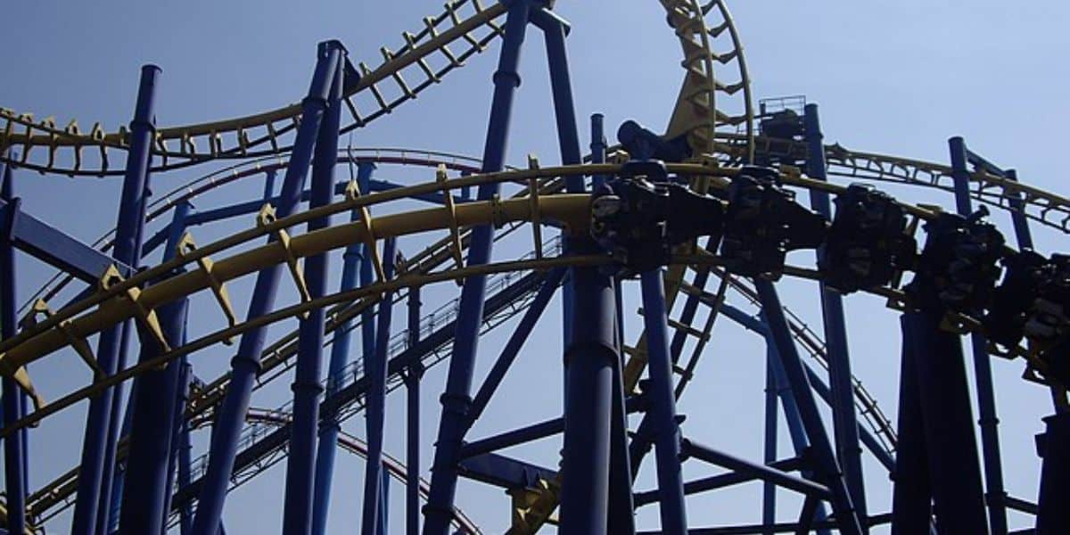 Close-up view of a blue and yellow steel Batman roller coaster at Six Flags Mexico.