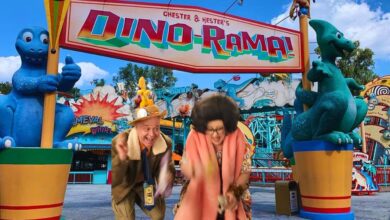 Hester and Chester under the Dino-Rama sign in DinoLand USA