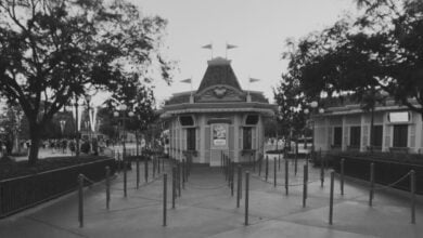 A black and white photo of a ticket booth at Disneyland Resort.
