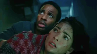 Two characters facing the Allosaurus in the 'Jurassic World' short film 'Battle at Big Rock'