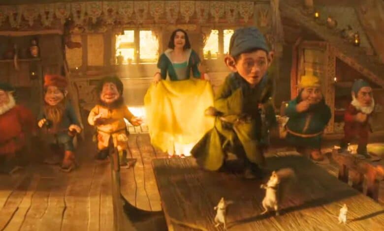 Snow White (Rachel Zegler) dancing with the seven "dwarf" characters in live-action 'Snow White'