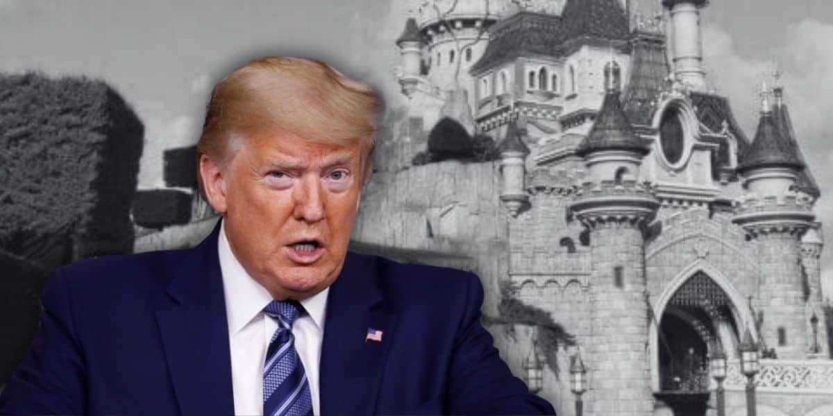 Trump in front of a black & white photo of Sleeping Beauty Castle at Disneyland Paris.