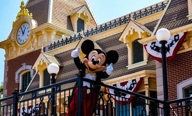 Mickey Mouse waves to guests at Disneyland, where Downtown Disney is located.
