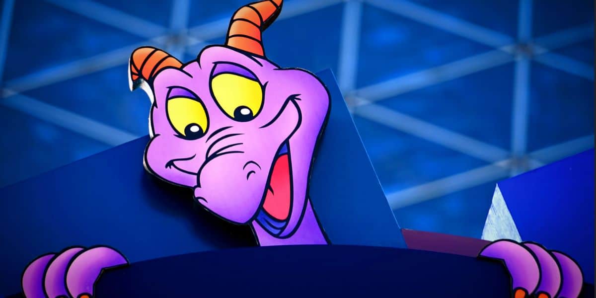 An image of Figment outside of the Imagination Institute at EPCOT