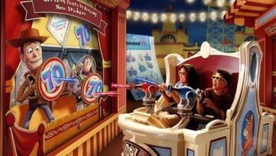 two guests shoot at screens on Disney's Toy Story Mania! ride