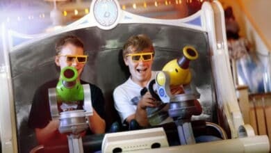 Two people ride Toy Story Mania