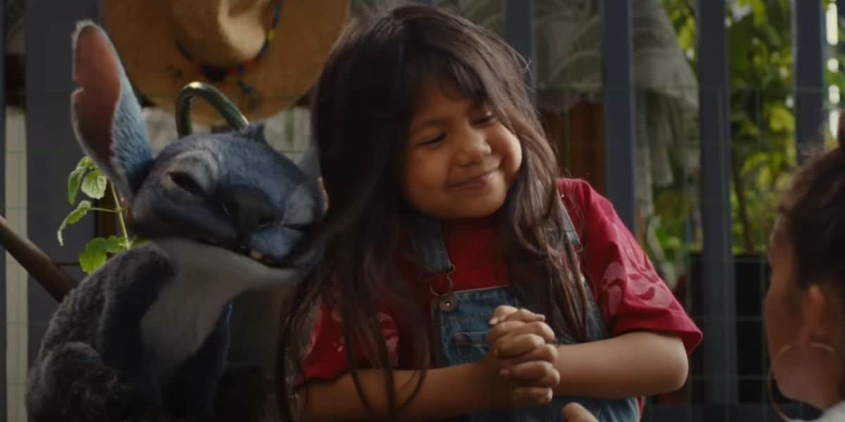 Stitch chews on Lilo's hair in the trailer for Disney's live action Lilo and Stitch.