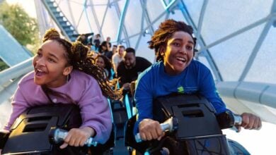A young boy and young girl ride TRON Lightcycle/Run at the Magic Kingdom at Walt Disney World, where a Disney World guest got in trouble.