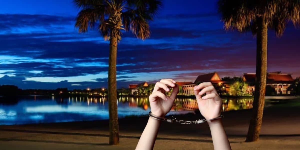 A person in handcuffs at Disney's Polynesian Village Resort